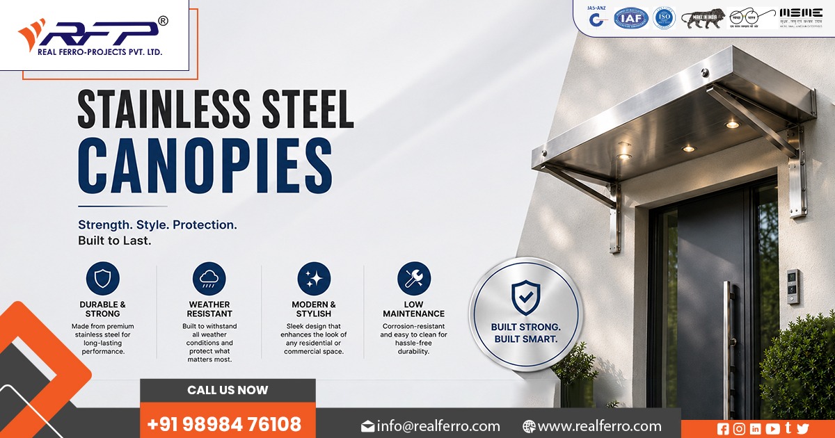 Modern stainless steel canopy installed at commercial building entrance by Real Ferro-Projects Private Limited